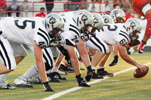 The football team gets into position during the Aug. 30 varsity game at Kimbrough Stadium.