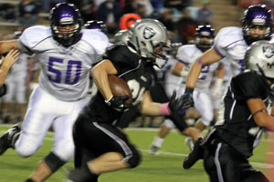 Junior Wyatt Garton drives for a TD at Randall's Oct. 11 game against Canyon.