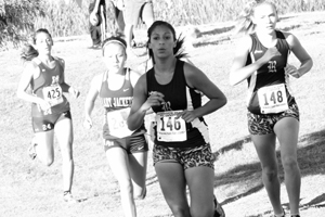 Senior Denise Altamirano runs during a cross country meet.