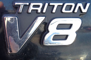 The V8 engine badge on the side of a Ford pickup. 
