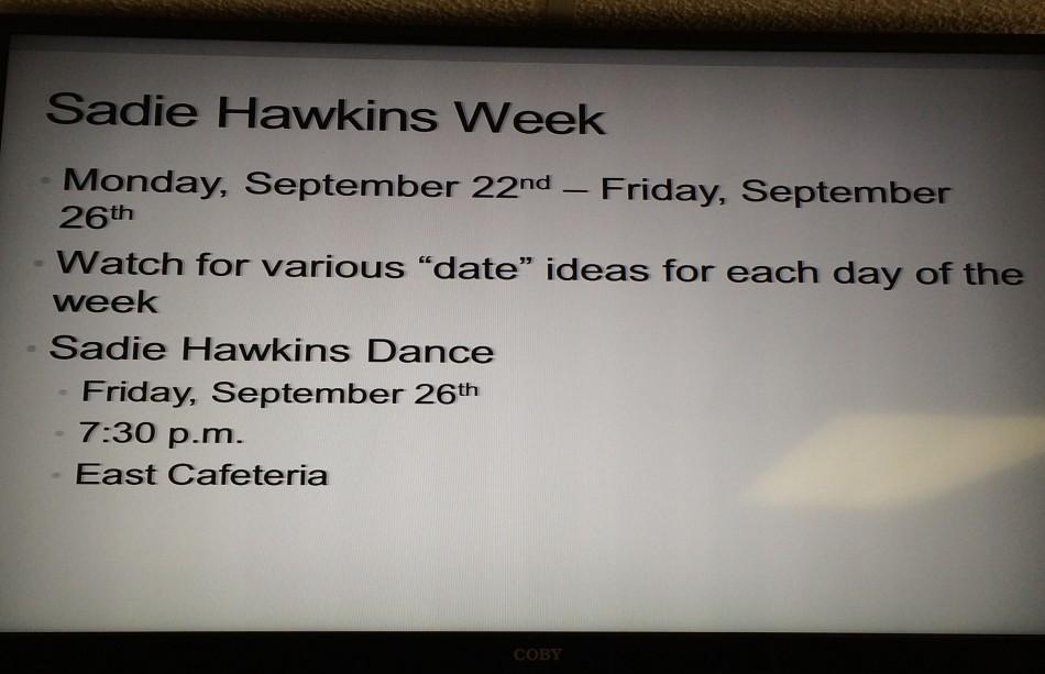 A monitor in the hallway displays information over Sadie Hawkins week. 