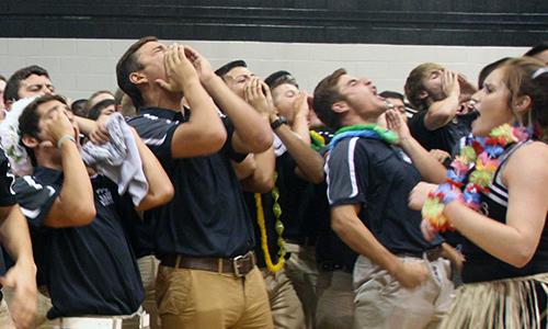 Upperclassmen participate in class yells during a pep rally in September. 