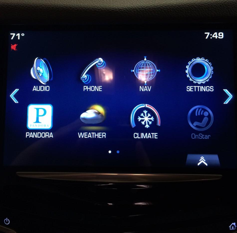 The large touch screen with several applications in a 2014 Cadillac SRX. 