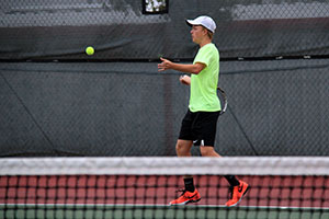 Senior Macauley Webb hits a forehand against Borger on Sept. 17.