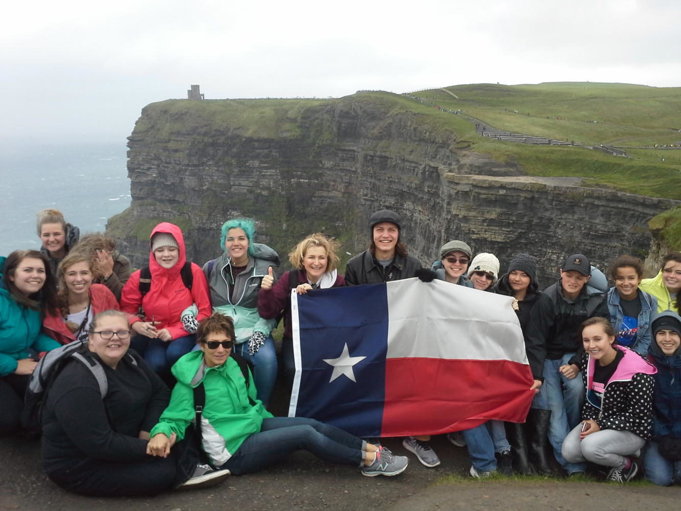 Mrs. Weston and the 16 students on the Cliffs of Moher, with a 700 foot drop behind them.