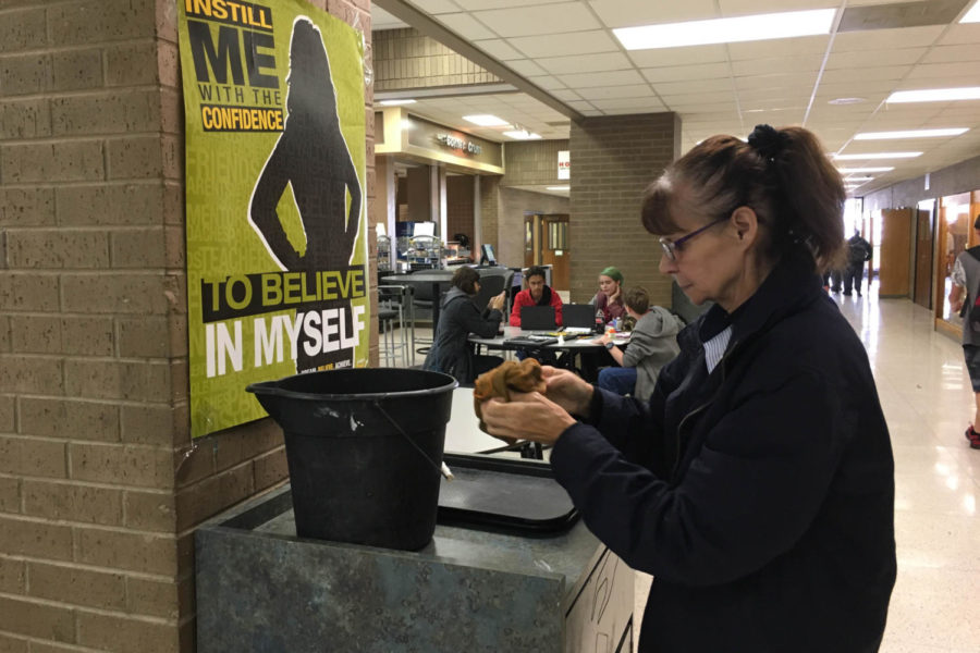 Vicki Day cleans the cafeteria during first lunch.