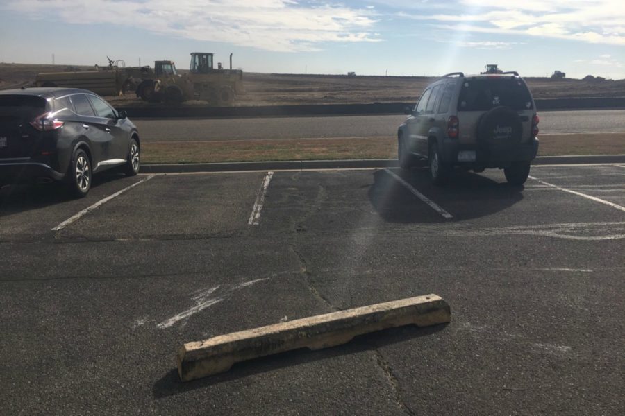 Parking spaces blocked by curb stopper