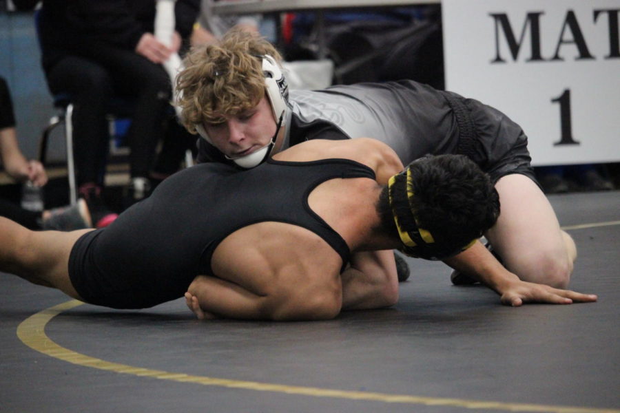 Sophomore Jaydn Heaton wrestles during the district meet Feb. 9.