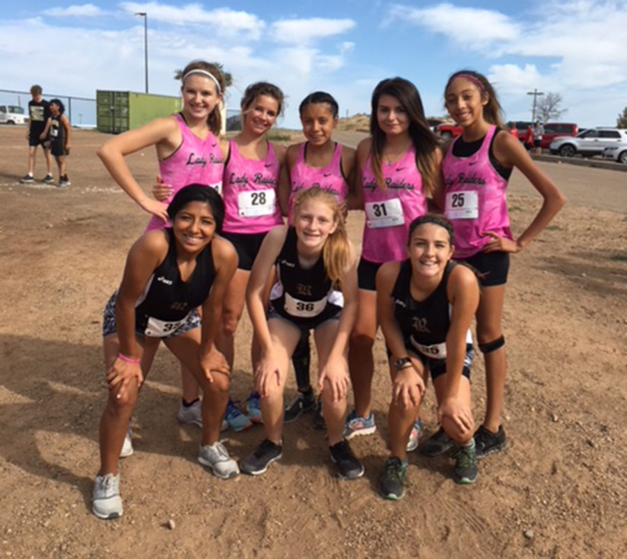 The girls cross country team gathers after competing in the Borger Meet.