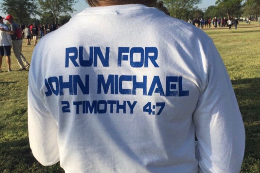 The Randall Cross Country team wears shirts in memory of their former teammate John Michael Morrison. 
