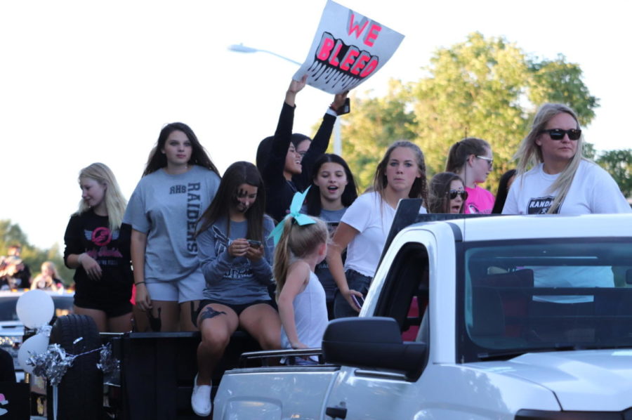 Student organizations and sports teams create and ride in floats during the annual homecoming pep rally Sept,. 27.