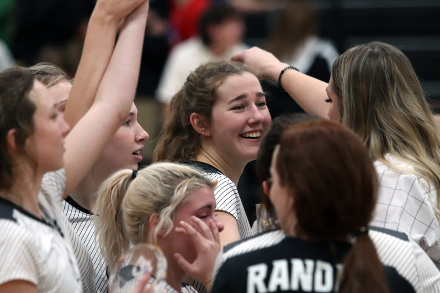 Senior Brianna Ford celebrates with her teammates after the Raiders defeated Amarillo High Nov. 16 to advance to the state tournament. 