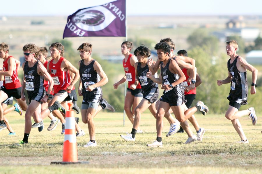 The Varsity Boys team takes off in a shotgun start during the Oct. 2 meet at Canyon High School.