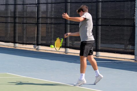 Cutter Mason prevents Lubbock High from scoring during his doubles match.