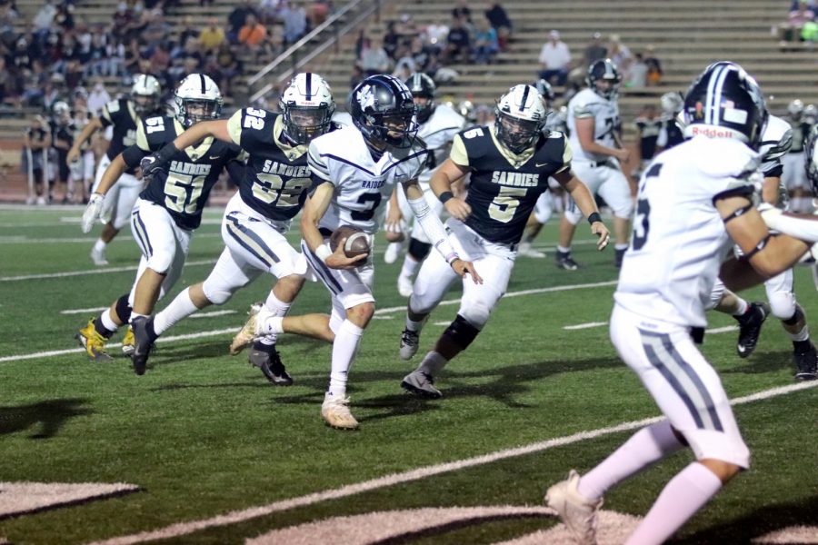 Quarterback senior Jared Gallegos runs the ball for touchdown.