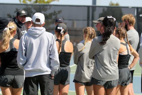The tennis team gathers on their home court before a match against Lubbock High. 