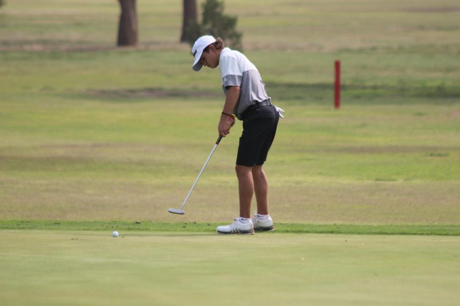 Sophomore Preston Drury putts in the Sept. 19 Canyon Invitational at Palo Duro Creek Golf Course.