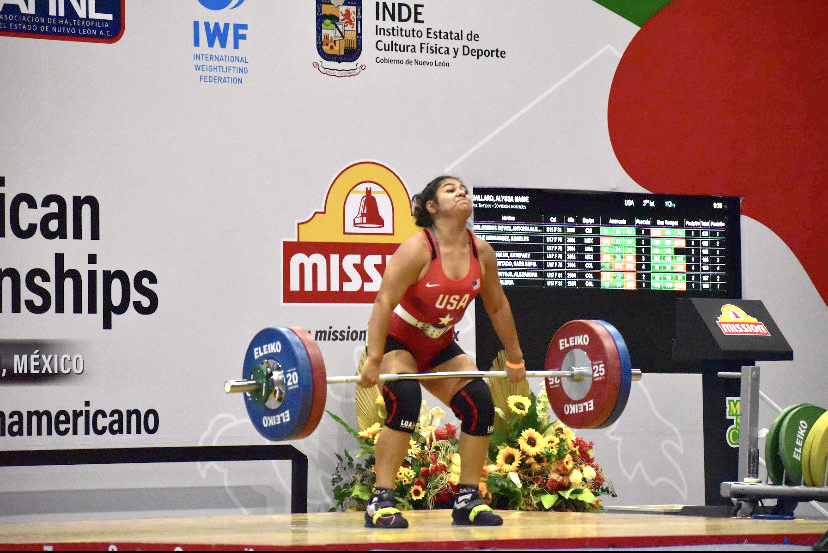 Senior weightlifter Alyssa Ballard performs the clean and jerk lift during the August 2021 Pan-American competition in Mexico.