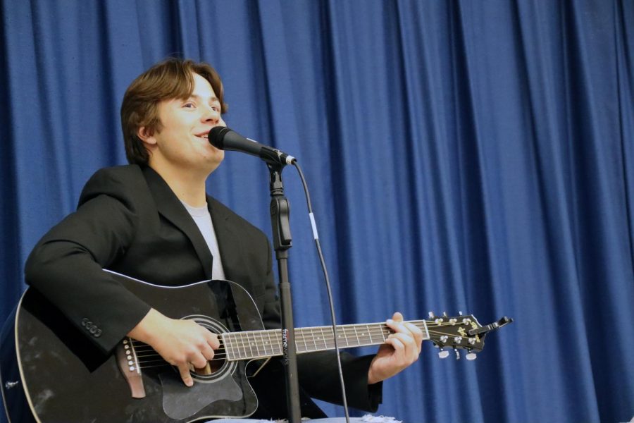 Bravo member and guitar player Brett Kashuba plays and sings for the crowd.