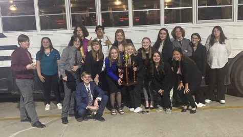 The Speech and Debate team gather after the Boom-Town tournament.