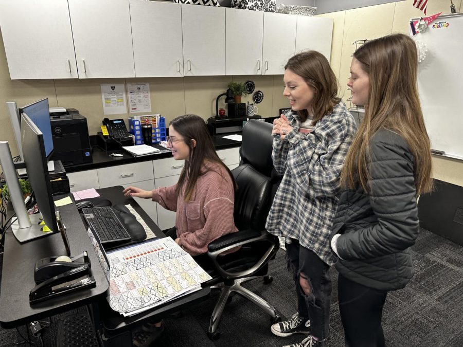 Yearbook editors Alannah Comerford, Ainsley Osborne and Ava Jones submit the final page of the yearbook before Spring Break. 