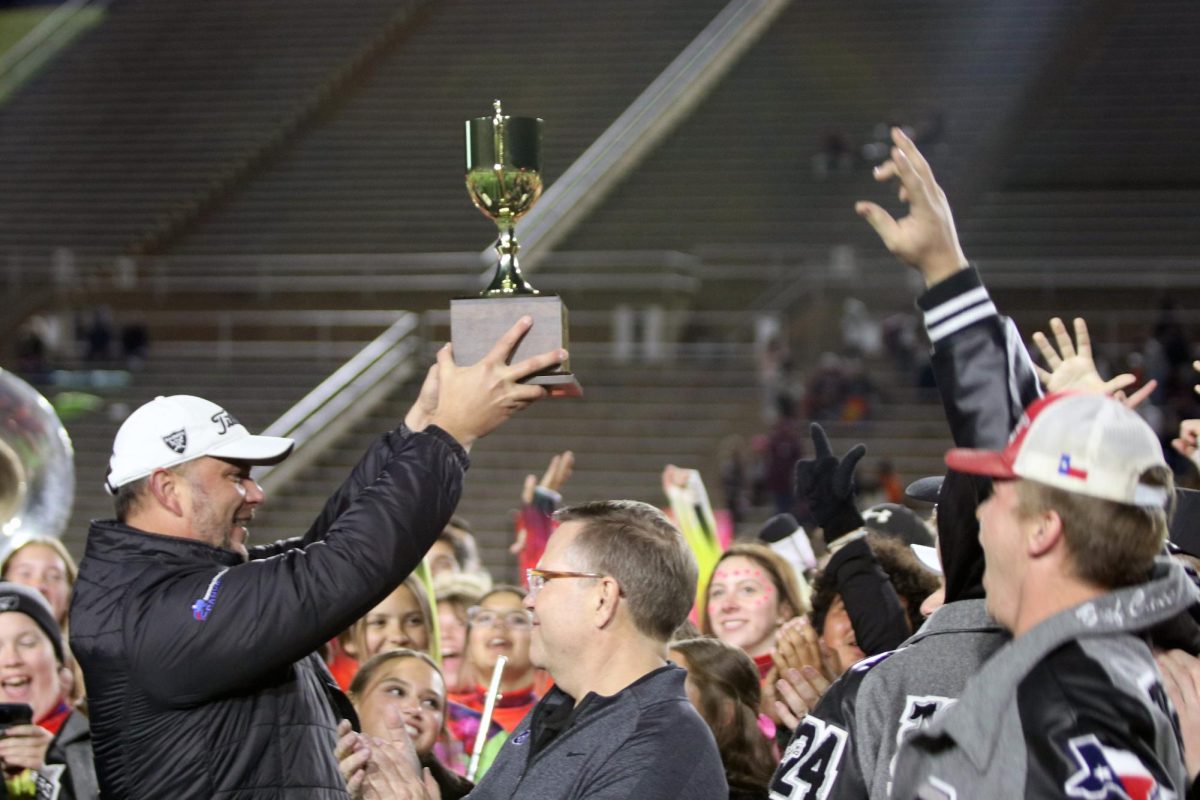 Principal Singleton receives the Lone Star Cup on Nov. 3, 2024. Randall High School won the Lone Star Cup for the second year in a row.