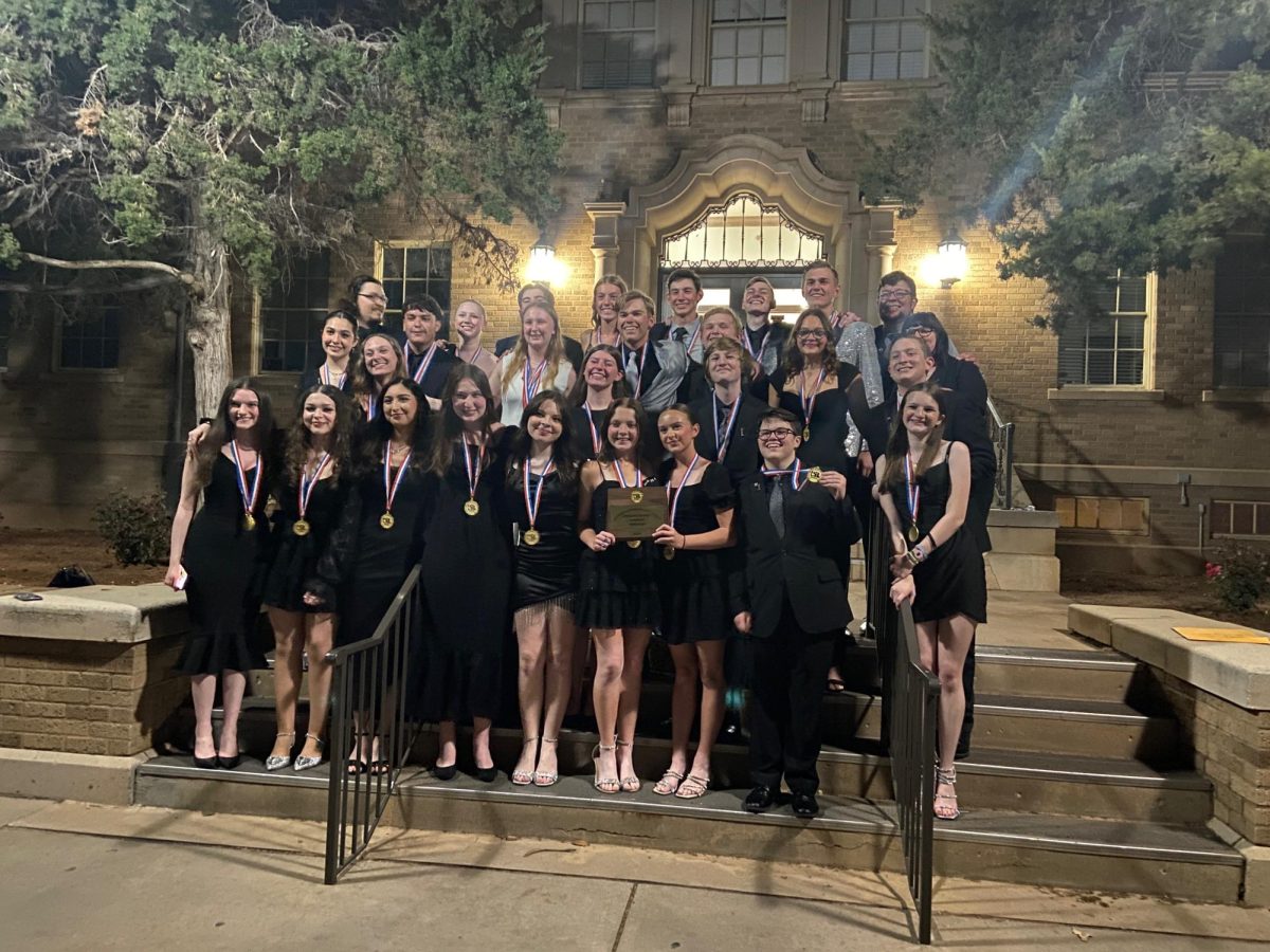 The cast of "The Hiding Place" poses with their medals after the region competition. They earned first place at region.