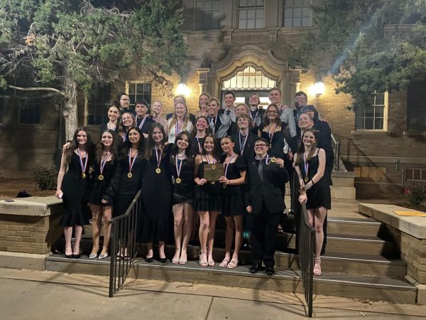 The cast of "The Hiding Place" poses with their medals after the region competition. They earned first place at region.